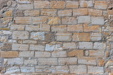 Stone wall background close up. Part of fortifications.