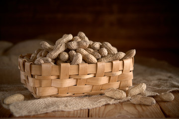 earth-nut. peanuts in a wicker basket