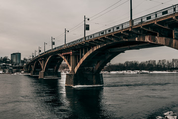 Fototapeta na wymiar The bridge over the Angara River in the Siberian city of Irkutsk