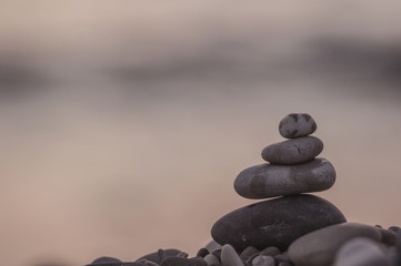 stack of zen stones on pebble beach