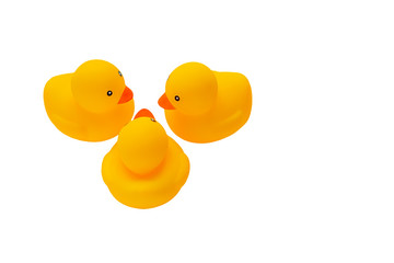 Cute toys yellow rubber ducklings on a white background