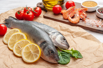 Fresh seabass fishes and shrimps