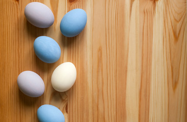Easter eggs colorful on wooden background