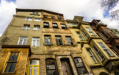 View of Balat houses / homes which is a historic district in Istanbul in Marmara region, Turkey. Traditional Ottoman houses in Istanbul's European side. Sepia color tones.