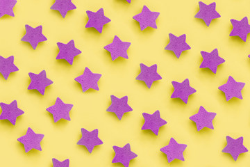 Pink stars on yellow background, place for text. pink cookies. Copy space. Mock up