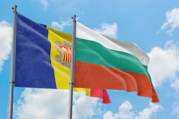 Bulgaria and Andorra flags waving in the wind against white cloudy blue sky together. Diplomacy concept, international relations.