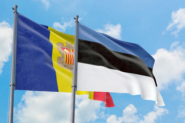 Estonia and Andorra flags waving in the wind against white cloudy blue sky together. Diplomacy concept, international relations.