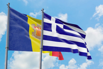 Greece and Andorra flags waving in the wind against white cloudy blue sky together. Diplomacy concept, international relations.