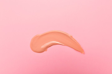 Sample of BB cream on color background