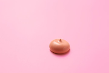 Sample of BB cream on color background