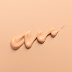 Sample of BB cream on color background