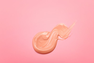 Sample of BB cream on color background