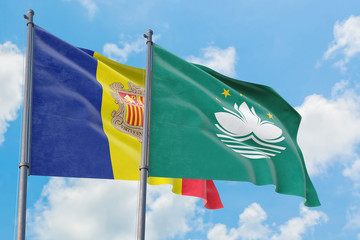 Macao and Andorra flags waving in the wind against white cloudy blue sky together. Diplomacy concept, international relations.