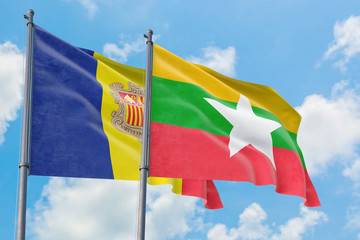 Myanmar and Andorra flags waving in the wind against white cloudy blue sky together. Diplomacy concept, international relations.