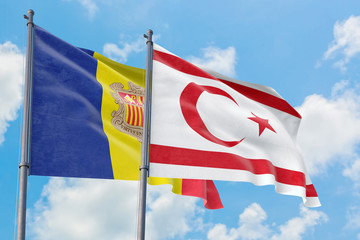 Northern Cyprus and Andorra flags waving in the wind against white cloudy blue sky together. Diplomacy concept, international relations.