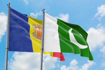 Pakistan and Andorra flags waving in the wind against white cloudy blue sky together. Diplomacy concept, international relations.