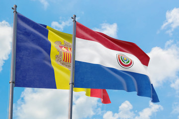 Paraguay and Andorra flags waving in the wind against white cloudy blue sky together. Diplomacy concept, international relations.