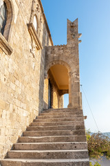 Fototapeta na wymiar Side stairs to building of Monastery of Filerimos on Acropolis of Ialyssos (Rhodes, Greece)