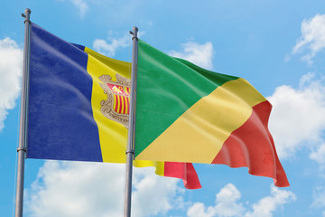 Republic Of The Congo and Andorra flags waving in the wind against white cloudy blue sky together. Diplomacy concept, international relations.