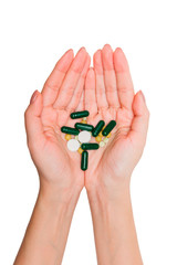 Pills in hands on a white background.
