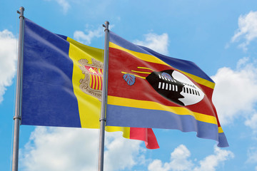 Swaziland and Andorra flags waving in the wind against white cloudy blue sky together. Diplomacy concept, international relations.