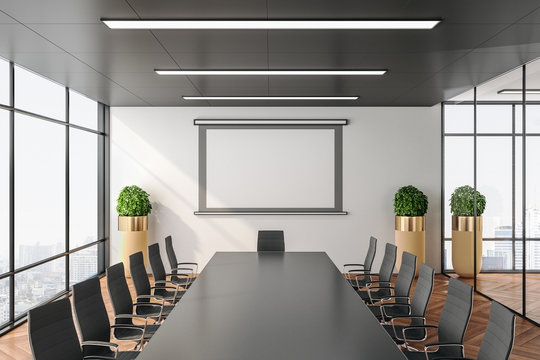 Contemporary Conference Office Room With Screen For Projector On Wall.