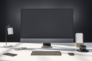 designer desktop with empty computer screen