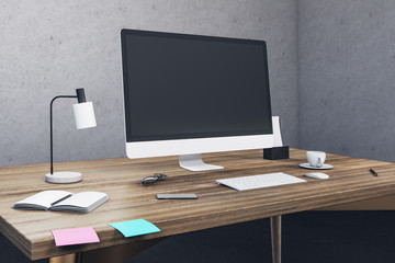 Minimalistic office with blank computer screen