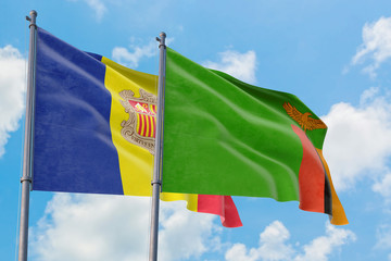 Zambia and Andorra flags waving in the wind against white cloudy blue sky together. Diplomacy concept, international relations.