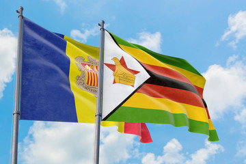 Zimbabwe and Andorra flags waving in the wind against white cloudy blue sky together. Diplomacy concept, international relations.