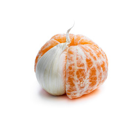 Concept of artificial fruit. Peeled mandarin with clove of garlic.