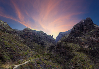 Scenery volcanic ravine landscape with sunset sky