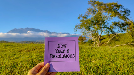 New year's resolutions written on paper stock photo