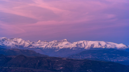 Obraz na płótnie Canvas Sunset over snowy mountains