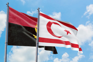 Northern Cyprus and Angola flags waving in the wind against white cloudy blue sky together. Diplomacy concept, international relations.