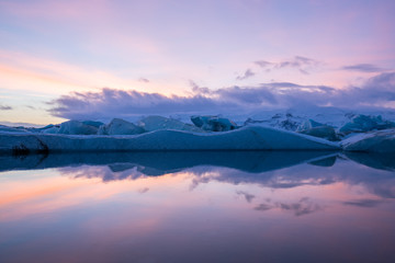 Fototapeta na wymiar Amazing landscapes during the sunset with huge glaciers in the Jokulsarlon Glacier Lagoon (glacial river lagoon) in the east Iceland