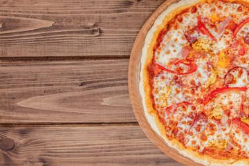 Pizza with Mozzarella cheese, salami, Tomatoes, pepper, Spices. Italian pizza