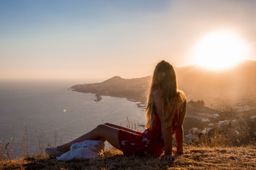 Sunset view person hiking madeira miradouro looking over bay of Funchal outdoor traveling concept