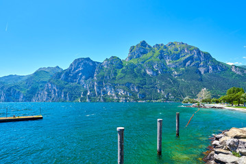 Panorama of the gorgeous Lake Garda surrounded by mountains in Riva del Garda, Italy.