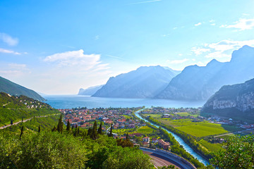 Panorama of the gorgeous Lake Garda surrounded by mountains in Riva del Garda, Italy.