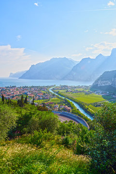 Panorama of the gorgeous Lake Garda surrounded by mountains in Riva del Garda, Italy.