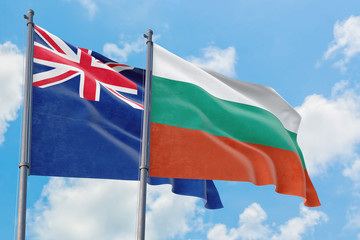 Bulgaria and Anguilla flags waving in the wind against white cloudy blue sky together. Diplomacy concept, international relations.