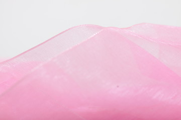 Pink satin ribbon texture for background / wallpaper