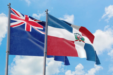 Dominican Republic and Anguilla flags waving in the wind against white cloudy blue sky together....