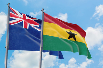 Ghana and Anguilla flags waving in the wind against white cloudy blue sky together. Diplomacy concept, international relations.