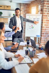 Group of business workers working together in a meeting. One of them making presentation to...