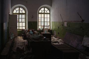 Abandoned ruined chemical laboratory. Old broken glassware