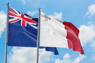 Malta and Anguilla flags waving in the wind against white cloudy blue sky together. Diplomacy concept, international relations.