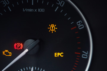Tachometer dial with needle showing zero rpm with diagnostic icons isolated on black background