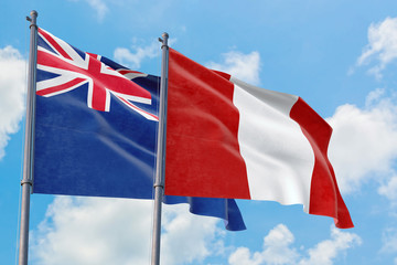 Peru and Anguilla flags waving in the wind against white cloudy blue sky together. Diplomacy concept, international relations.